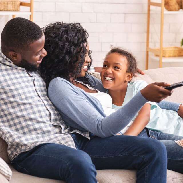 Family watching television together