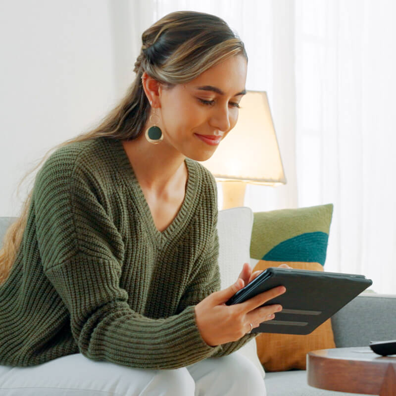 Woman on tablet switching to Astound