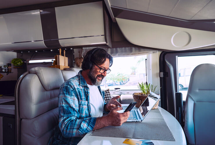 Man on his computer in his rv