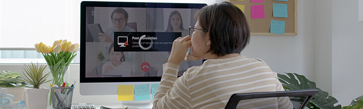 Woman's screen is buffering, interrupting her video conference call