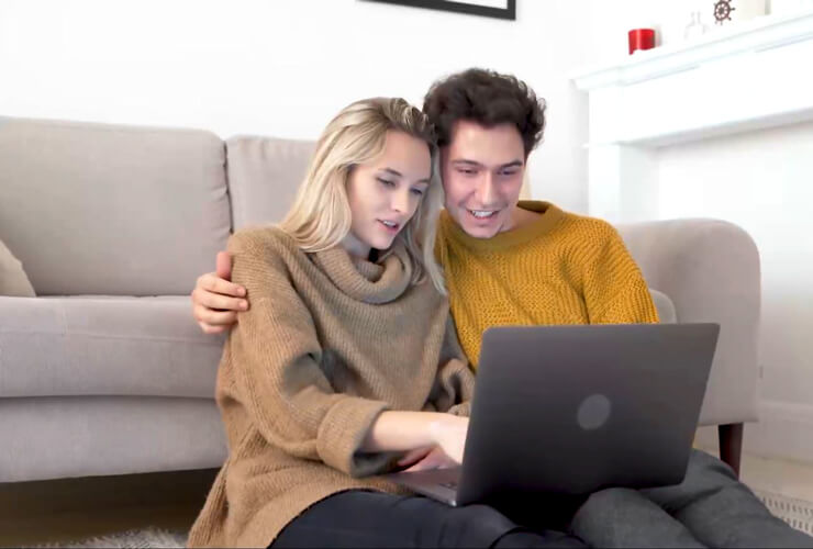 couple streaming shows on their laptop