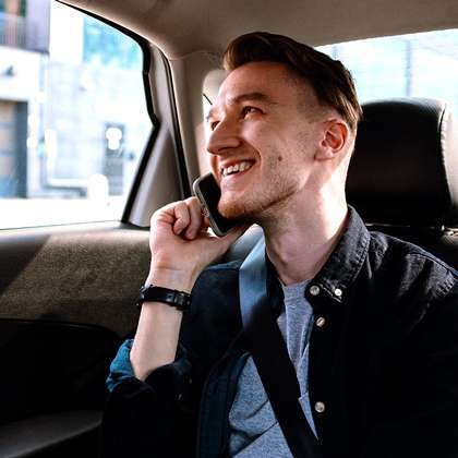 man in car on mobile phone