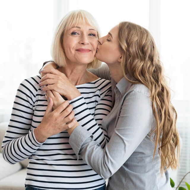 Mom and daughter hugging on Mother’s Day