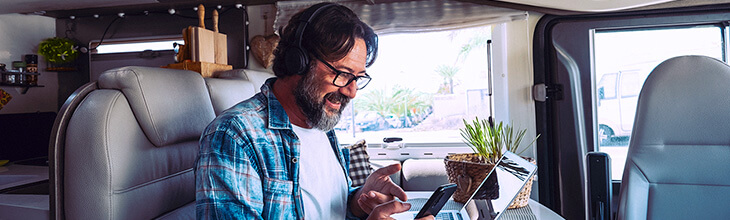 Man on his computer in his rv